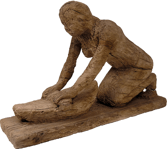 Ξύλινο άγαλμα γυναίκας που αλέθει σιτηρά